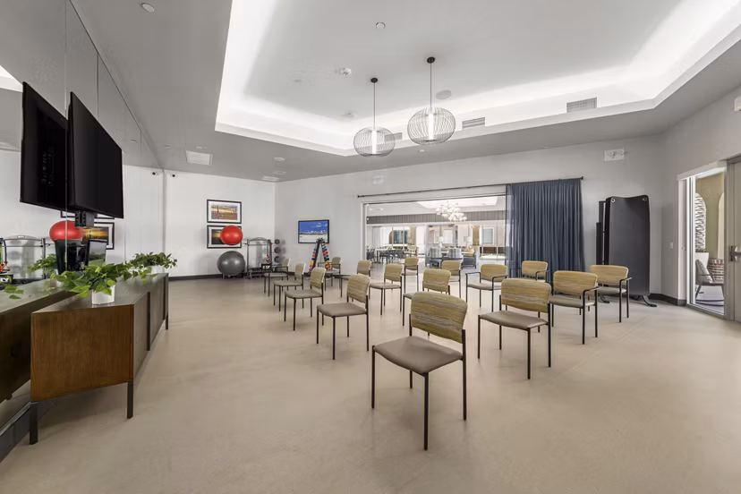 Elegant clubhouse with modern furnishings at Album Marana Apartments, perfect for social gatherings and community events