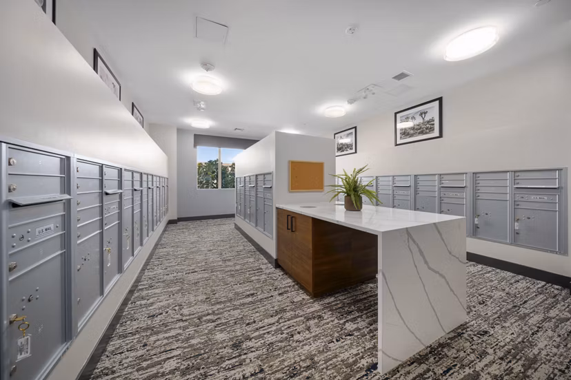 Mailroom with organized parcel lockers at Album Marana Apartments