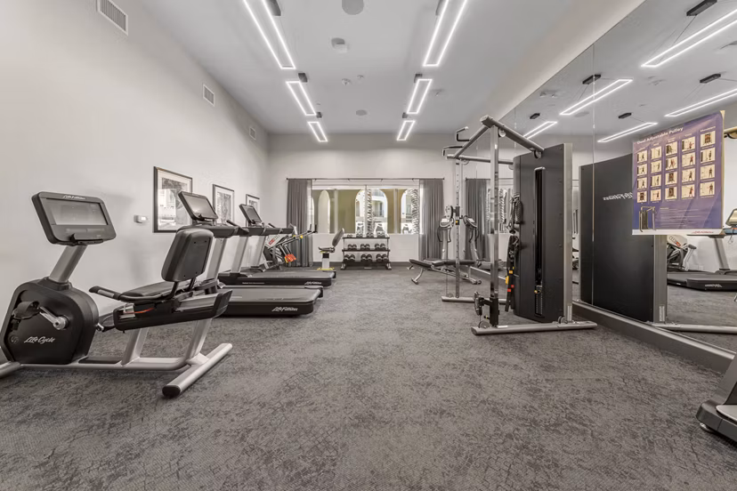 State-of-the-art fitness center with modern equipment at Album Marana Apartments, offering luxurious workout options for residents