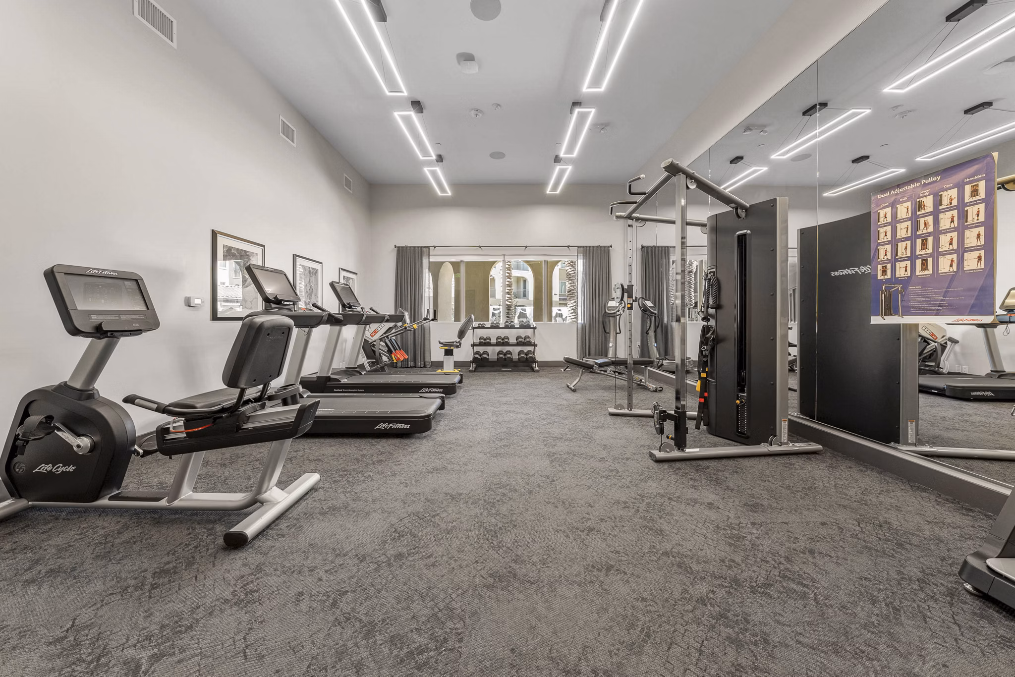State-of-the-art fitness center with modern equipment at Album Marana Apartments, offering luxurious workout options for residents