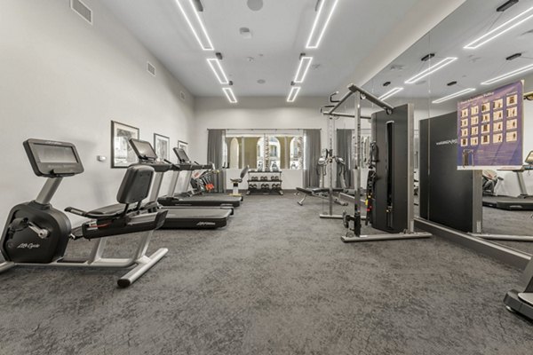 State-of-the-art fitness center with modern equipment at Album Marana Apartments, offering luxurious workout options for residents