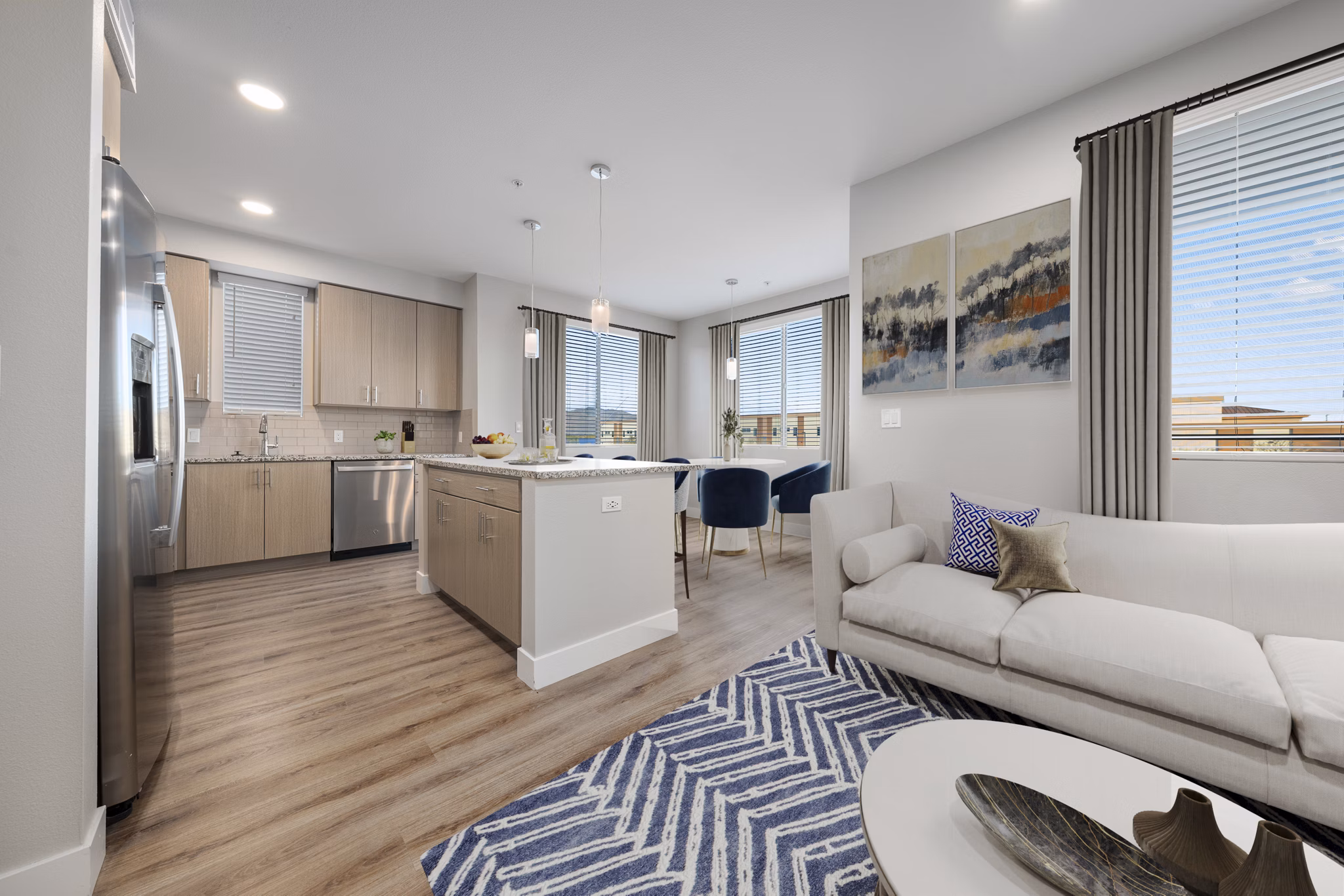 Modern kitchen with stainless steel appliances in Album Marana Apartments