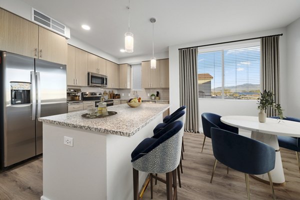 Modern kitchen with stainless steel appliances at Album Marana Apartments, offering luxury living with Greystar's quality management