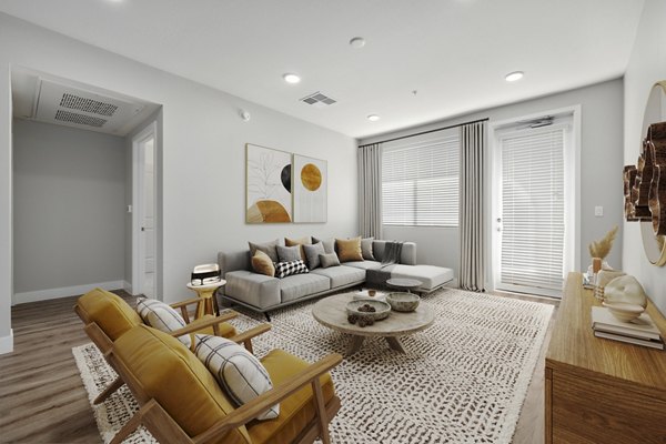 Living room featuring modern decor and ample natural light in Album Marana Apartments, luxury living in a relaxing environment