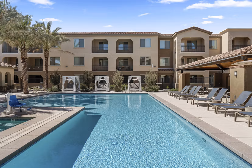Outdoor pool with seating area at Album Marana Apartments, luxury community in serene Marana setting
