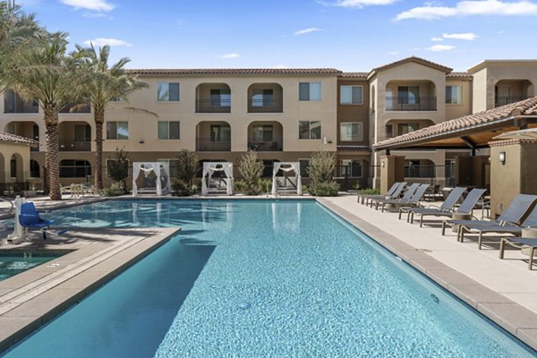 Outdoor pool with seating area at Album Marana Apartments, luxury community in serene Marana setting