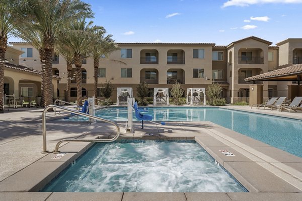 Resort-style pool at Album Marana Apartments offering luxury outdoor lounging and relaxation