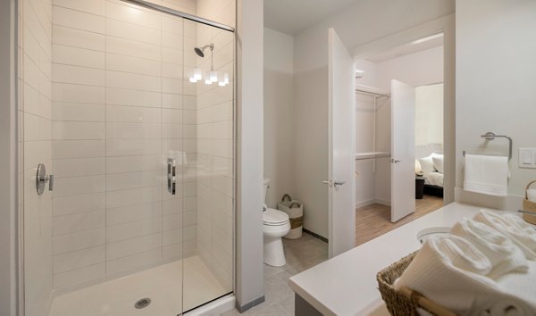 Elegant bathroom with modern fixtures at Darien Commons Apartments, showcasing luxury living in a premium Greystar community
