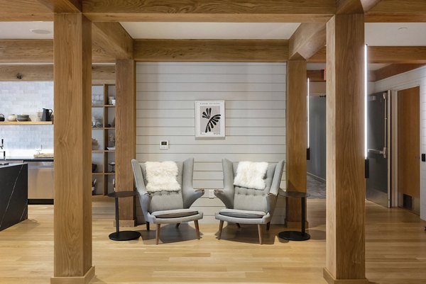 Darien Commons Apartments: Modern clubhouse featuring elegant seating and entertainment spaces