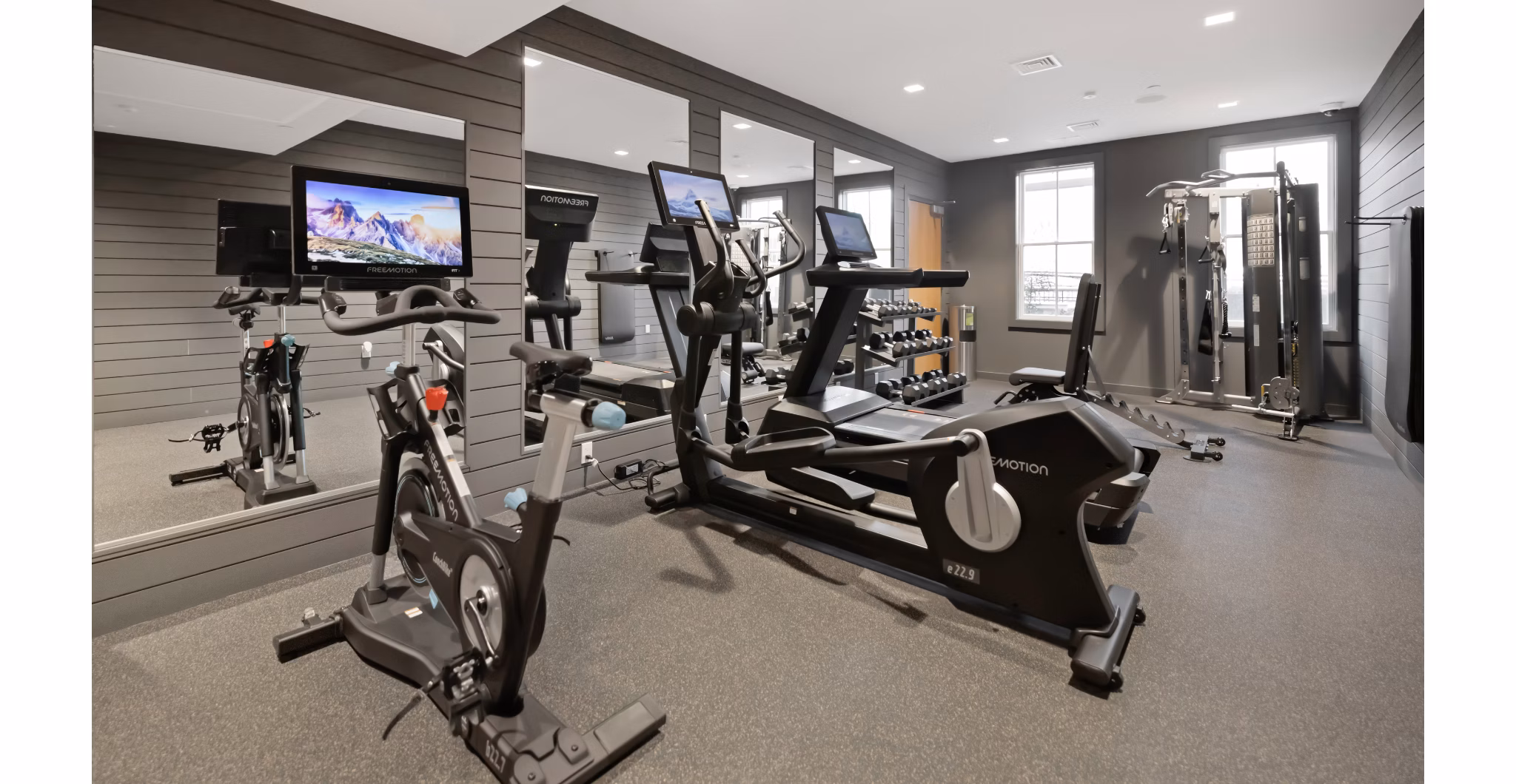 Fitness center featuring modern equipment at Darien Commons Apartments