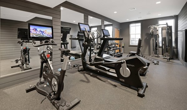 Fitness center featuring modern equipment at Darien Commons Apartments