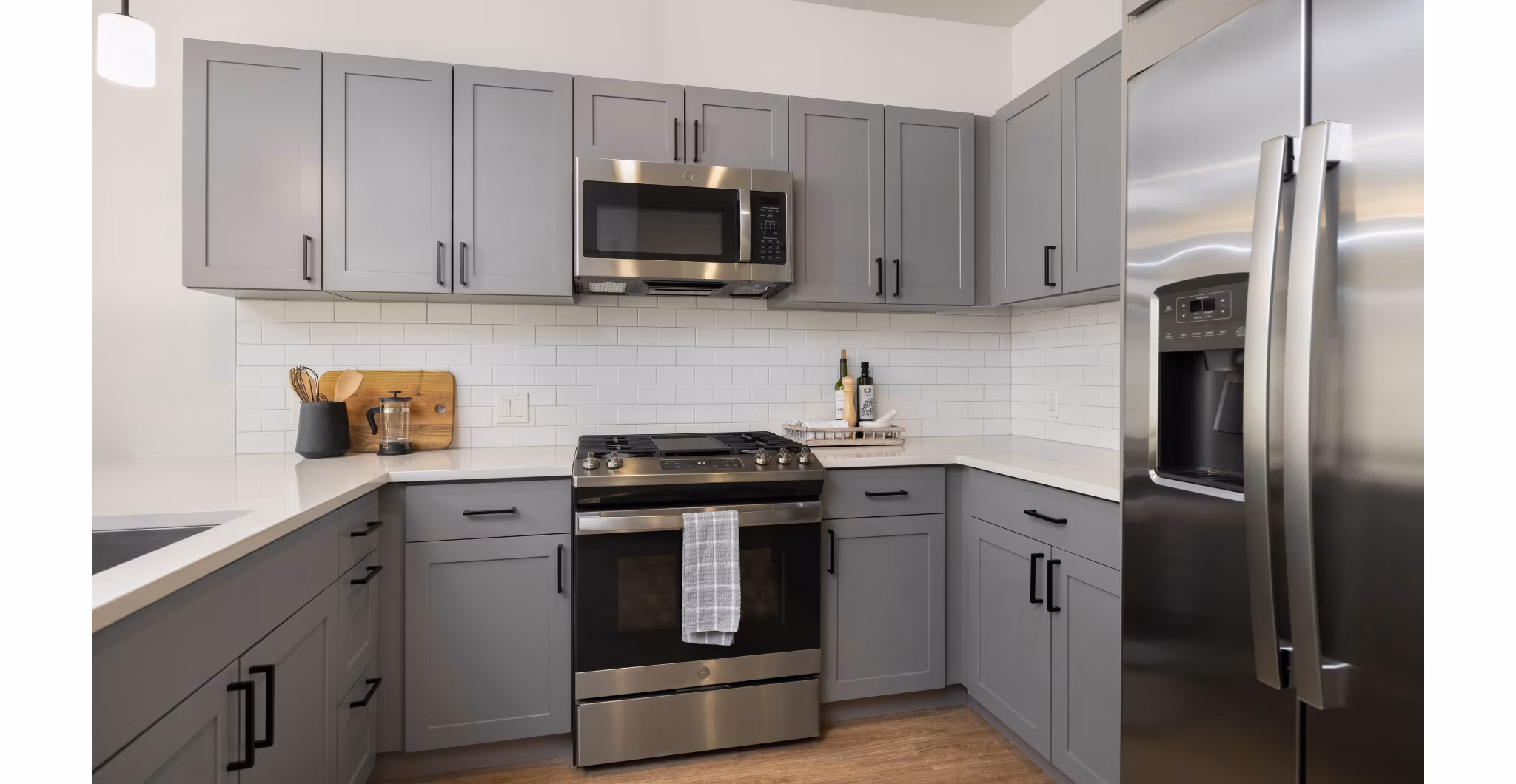 Modern kitchen featuring sleek countertops and stainless steel appliances at Darien Commons Apartments