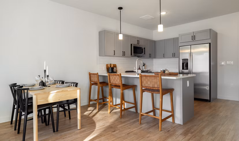 Modern kitchen with stainless steel appliances at Darien Commons Apartments