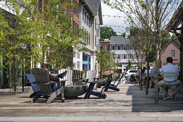 Modern neighborhood view near Darien Commons Apartments featuring vibrant community spaces and shops