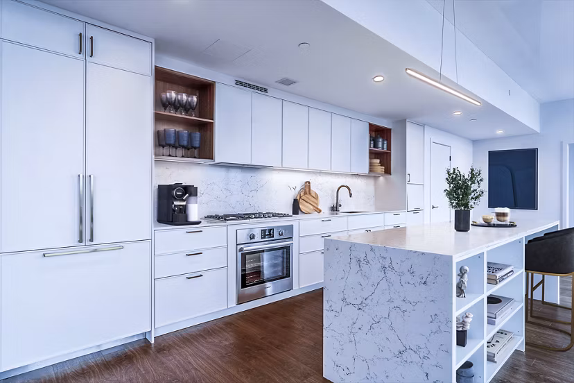 Modern kitchen with stainless steel appliances and sleek countertops at 212 Stuart Apartments, luxury living in Boston