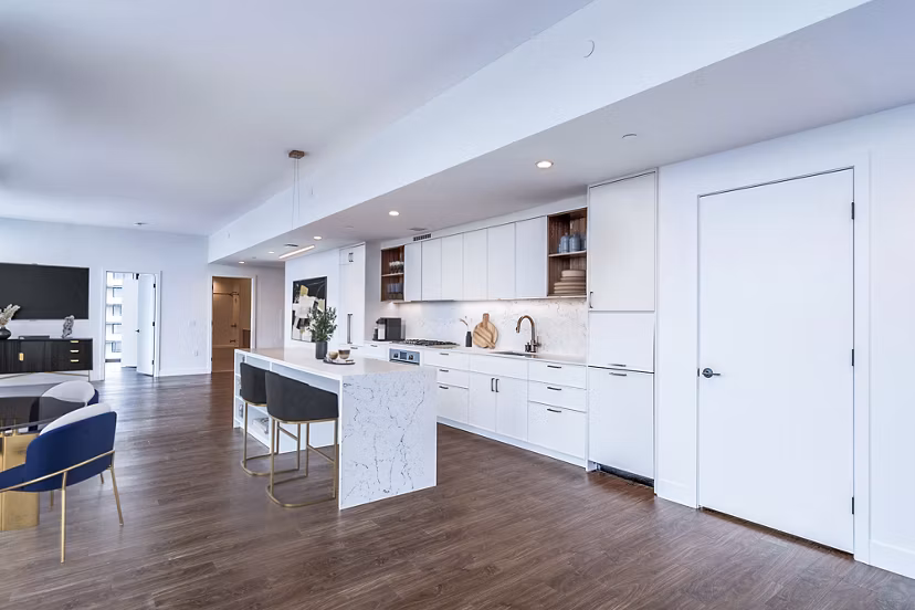 Modern kitchen with stainless steel appliances in 212 Stuart Apartments, luxury living in downtown Perfect for culinary enthusiasts and hosting