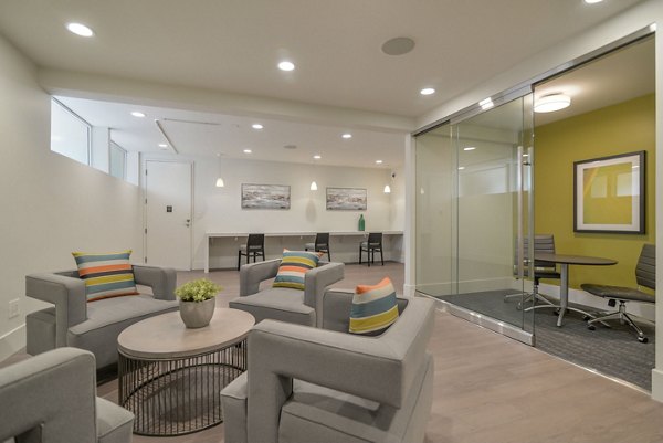 Towne at Glendale Apartments: Clubhouse with modern decor and communal seating