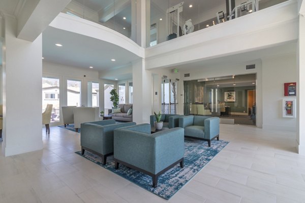 Towne at Glendale Apartments: Contemporary clubhouse with modern decor and ample seating for residents and guests