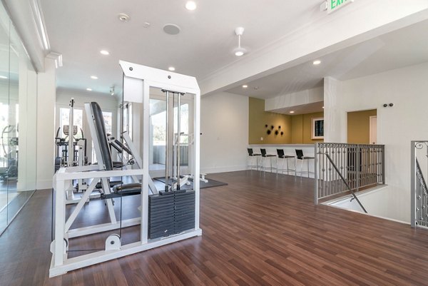 Well-equipped fitness center with modern machines at Towne at Glendale Apartments