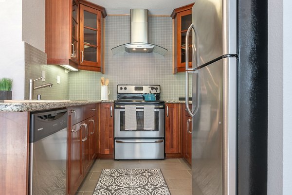 Modern kitchen with stainless steel appliances in Towne at Glendale Apartments