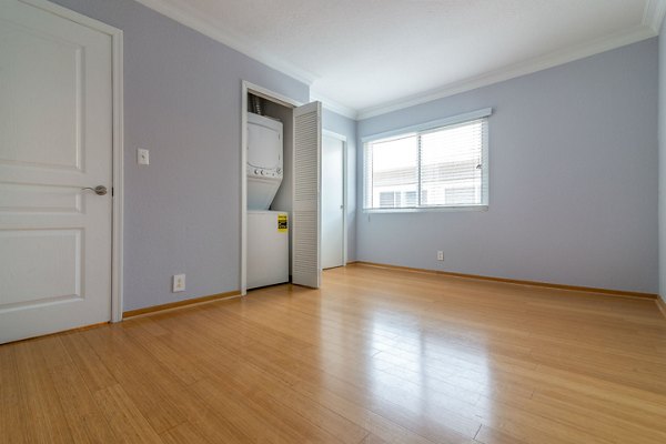 Laundry room with modern appliances in Towne at Glendale Apartments, providing convenient and efficient living space