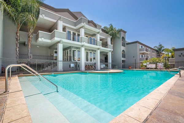 Sunlit outdoor pool at Towne at Glendale Apartments for relaxation and leisure