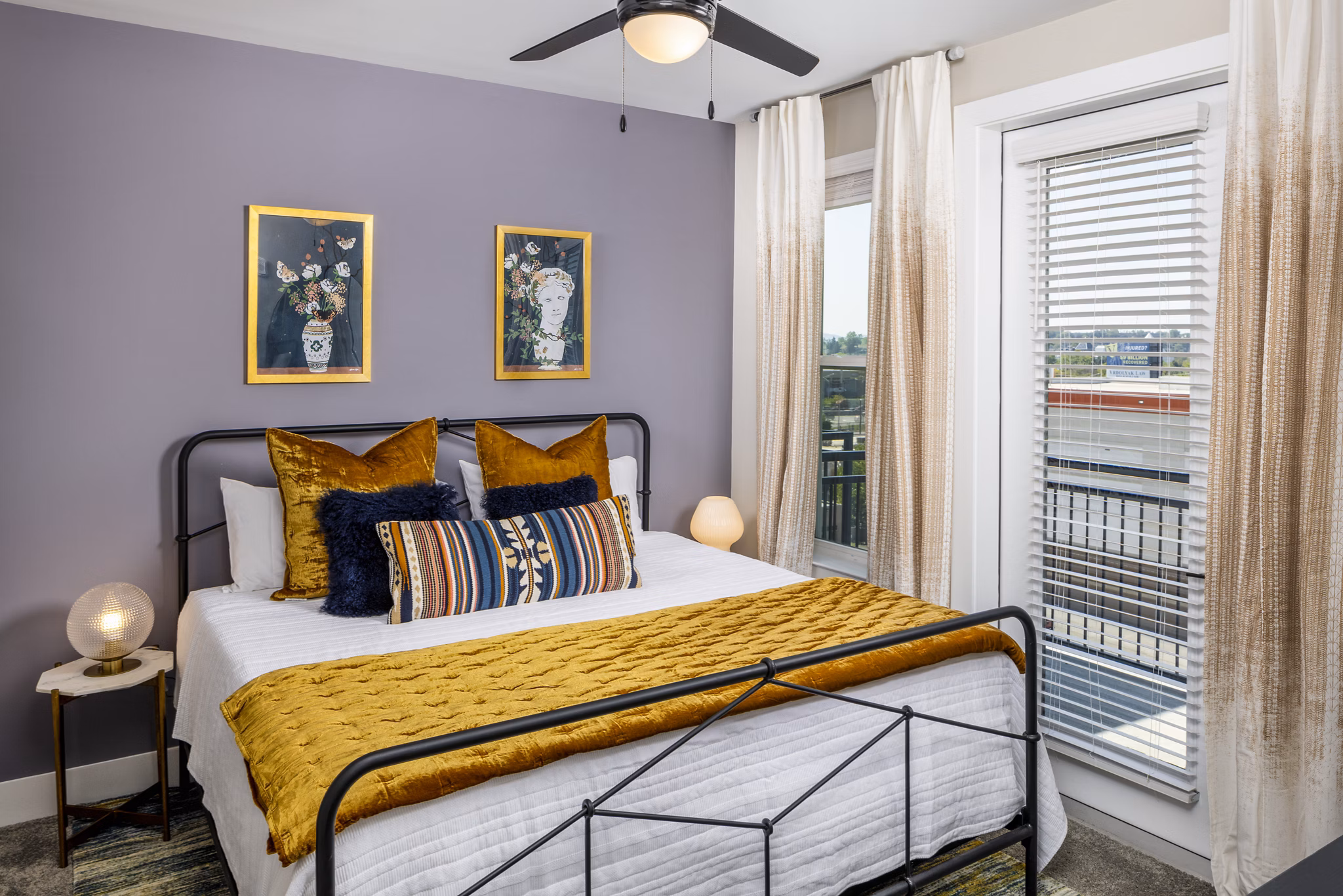Luxurious bedroom with ample natural light at Broadstone SoBro Apartments, featuring premium furnishings and modern amenities for comfortable living