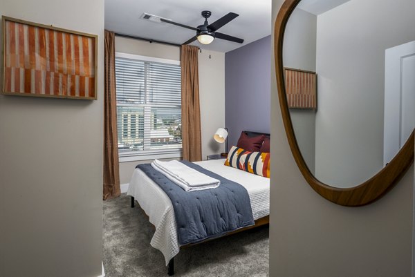 Luxury bedroom with chic decor at Broadstone SoBro Apartments, Nashville