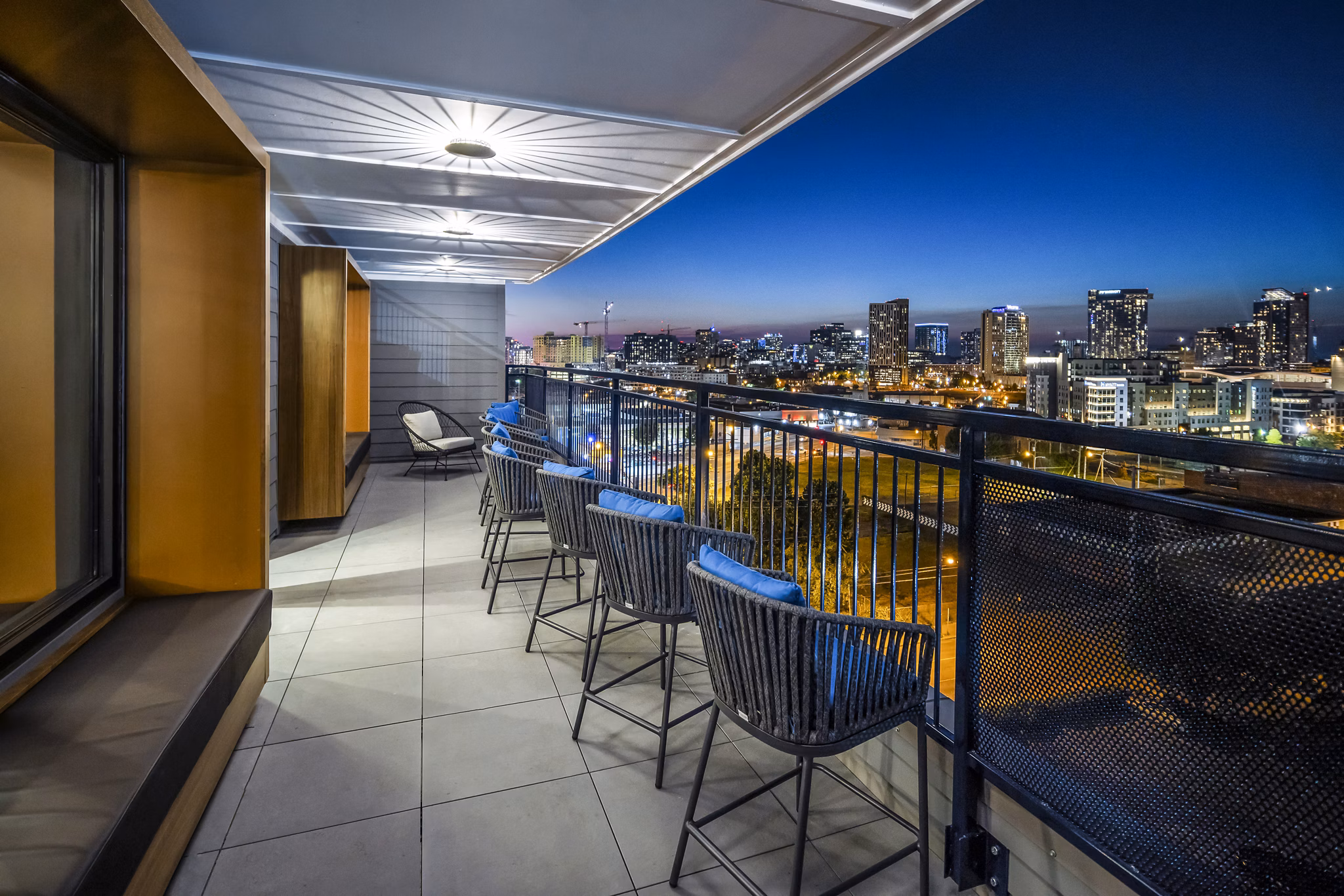 Stylish clubhouse with modern lounge seating and ambient lighting at Broadstone SoBro Apartments
