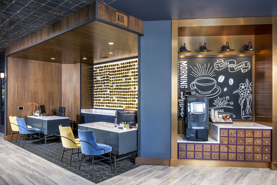 Stylish clubhouse lobby with modern decor at Broadstone SoBro Apartments, ideal for social gatherings and relaxation