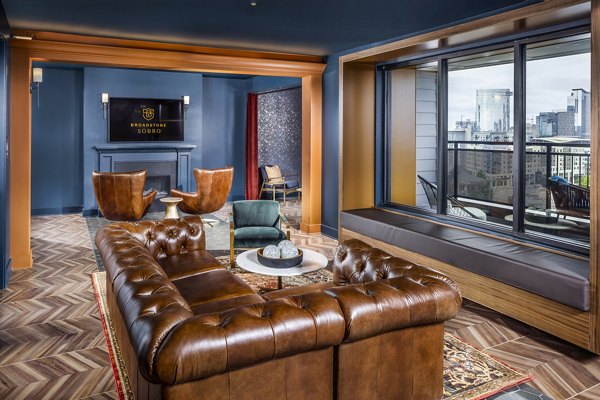 Clubhouse lobby featuring modern decor and seating at Broadstone SoBro Apartments