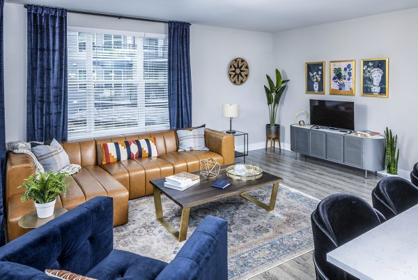 Modern living room with elegant furnishings at Broadstone SoBro Apartments, offering a luxurious residential experience in an upscale community