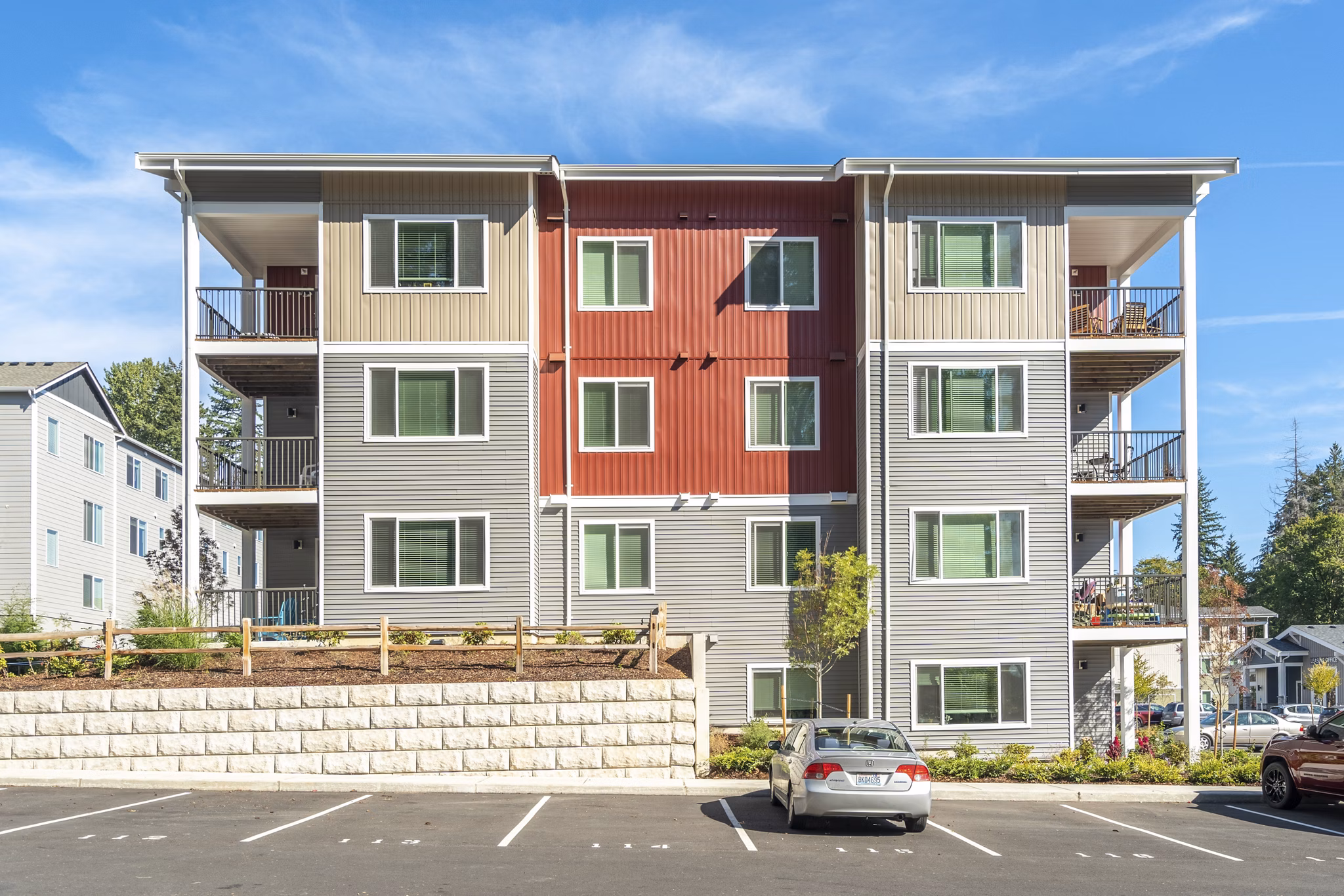 Park on 20th Apartments: Elegant facade of modern luxury apartments in vibrant cityscape