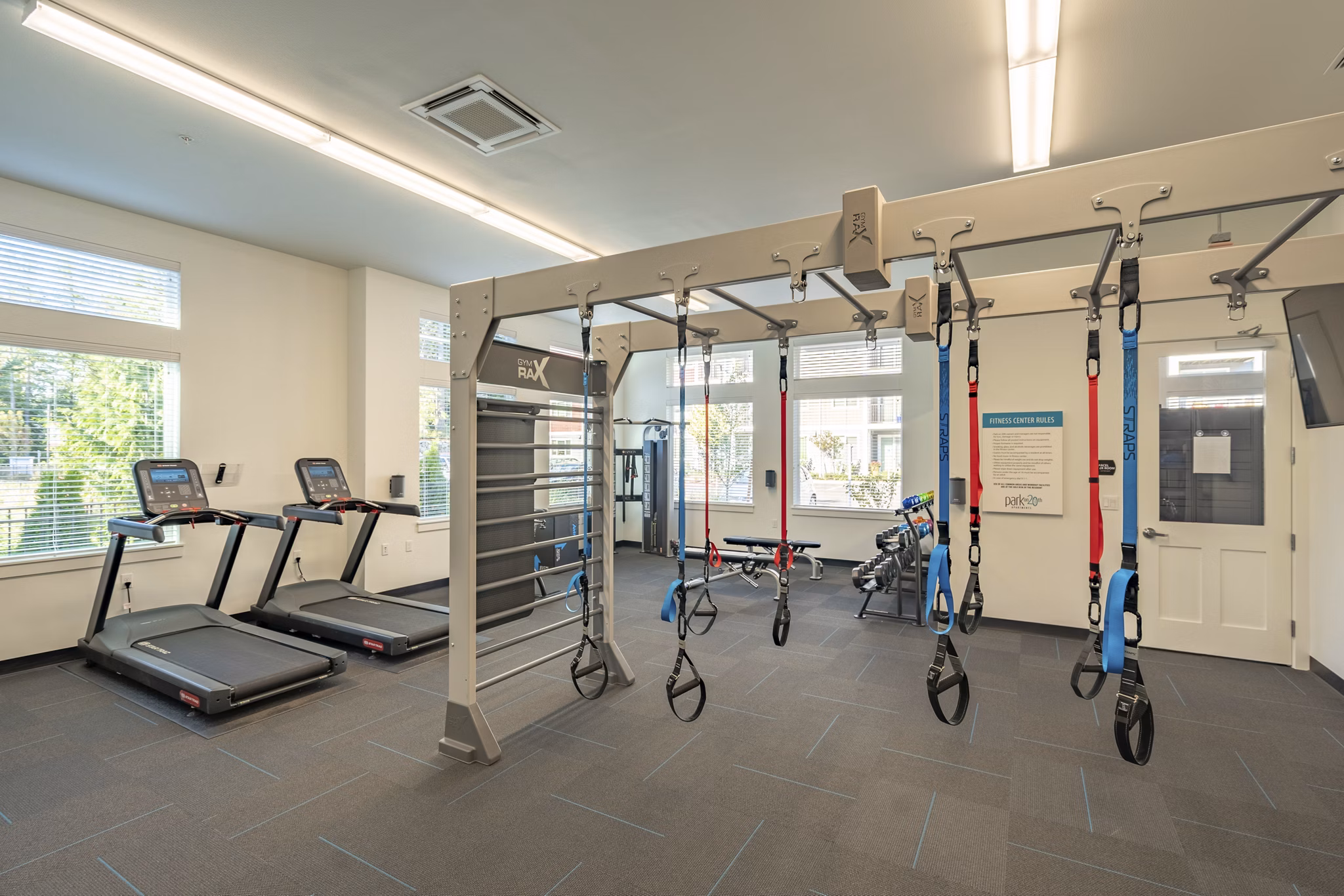 State-of-the-art fitness center with modern equipment at Park on 20th Apartments