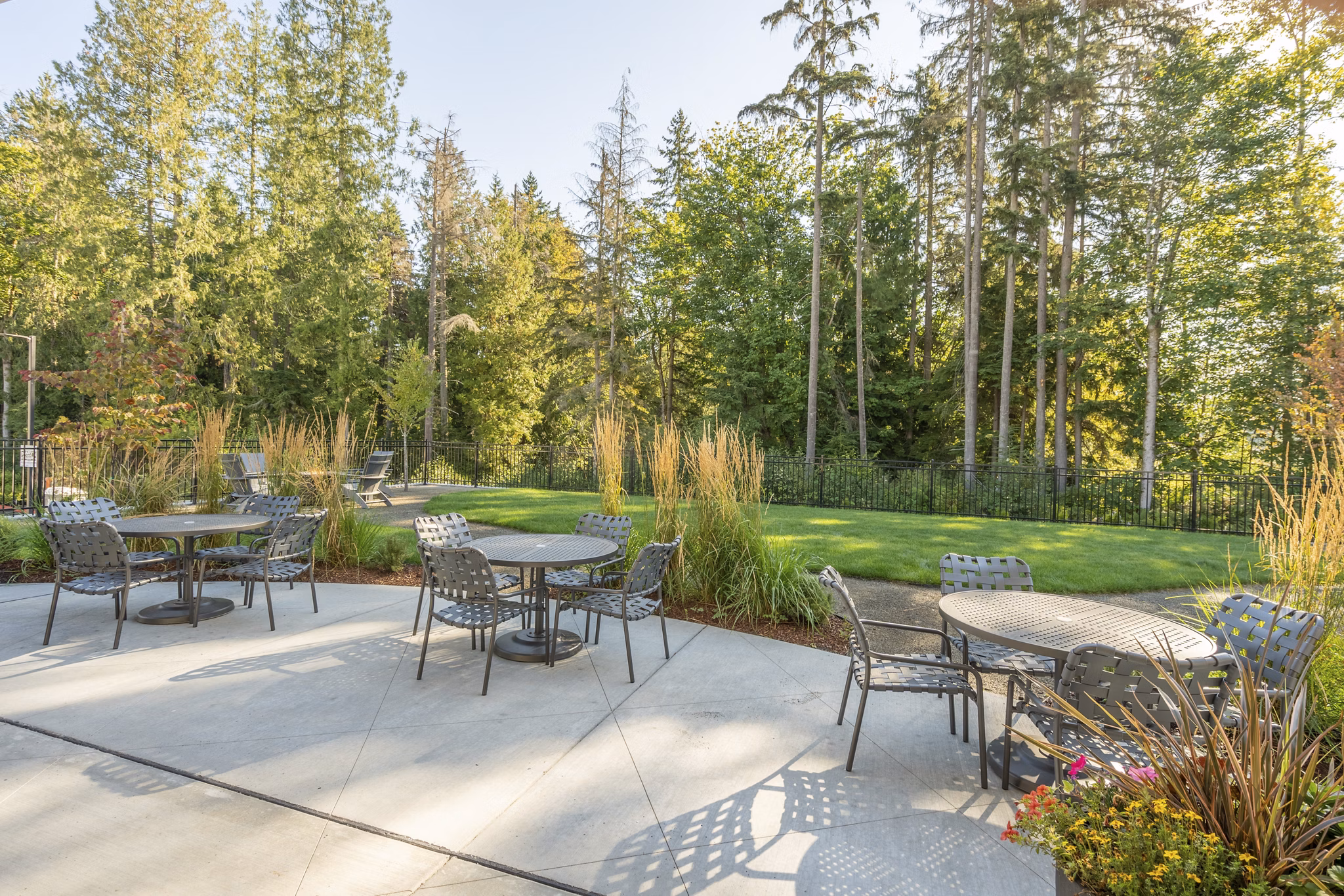 Courtyard with lush gardens and seating area at Park on 20th Apartments, a luxury community