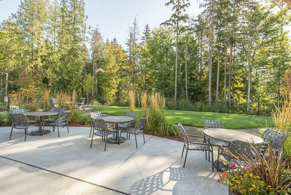 Courtyard with lush gardens and seating area at Park on 20th Apartments, a luxury community