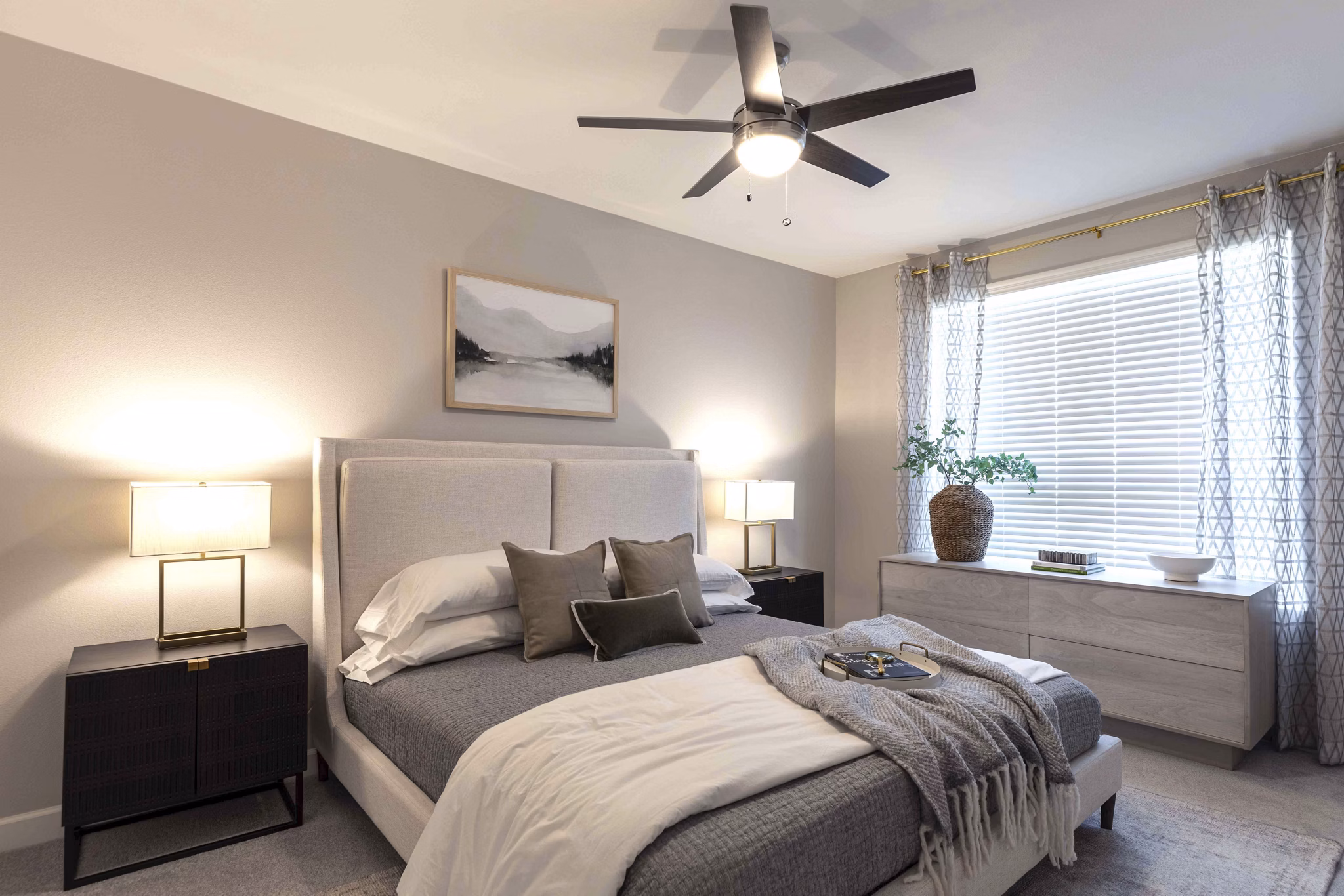 Cozy bedroom featuring contemporary decor at Avenida at Centerra Apartments