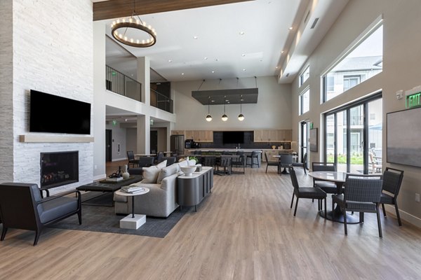 Avenida at Centerra Apartments: Modern clubhouse with elegant furnishings in a luxury apartment community