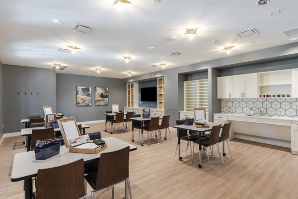 Clubhouse with cozy seating and modern decor at Avenida at Centerra Apartments