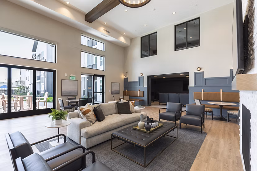 Clubhouse with modern design and comfortable seating at Avenida at Centerra Apartments