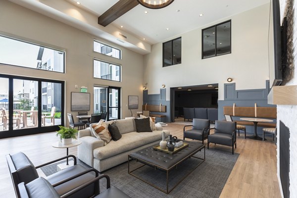 Clubhouse with modern design and comfortable seating at Avenida at Centerra Apartments