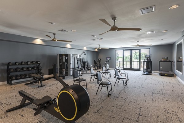 State-of-the-art fitness center at Avenida at Centerra Apartments featuring modern exercise equipment and spacious workout areas