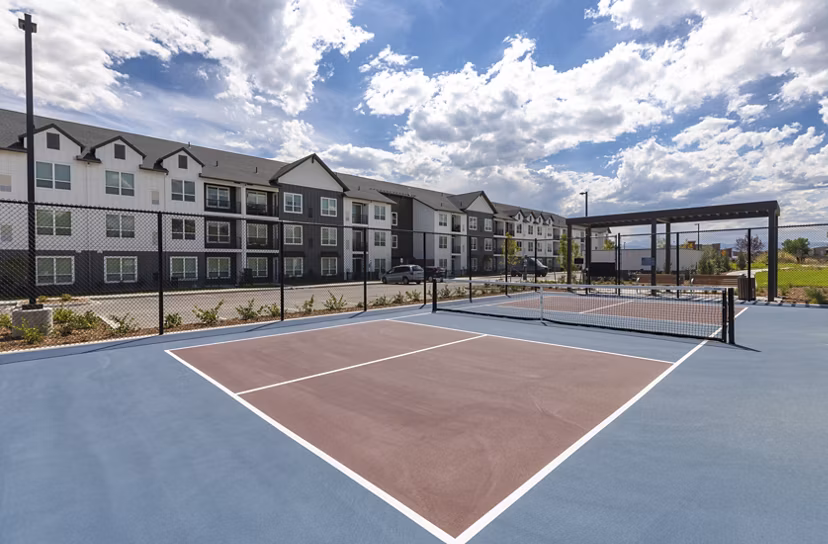Outdoor sport court at Avenida at Centerra Apartments for recreational activities and fitness enthusiasts
