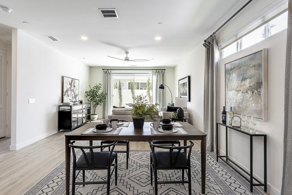 Dining room with elegant lighting and modern furniture at Vello Valley BTR Single Apartment Townhomes