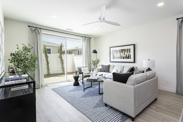 Living room featuring modern furnishings and natural light at Vello Valley BTR Single Apartment Townhomes
