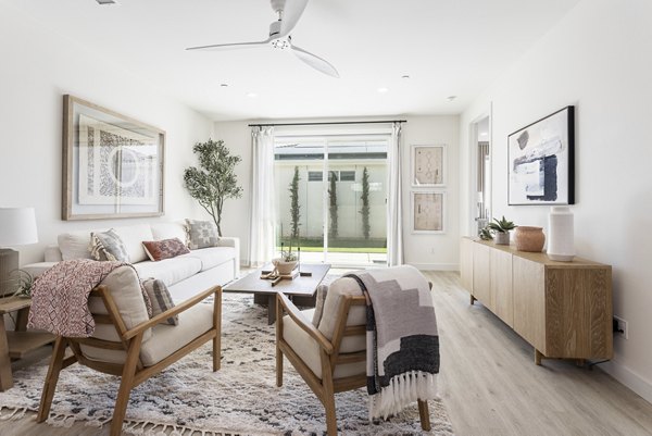 Living room with modern decor and spacious layout at Vello Valley BTR Single Apartment Townhomes, perfect for luxury living