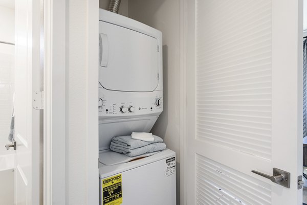 Laundry room featuring modern appliances at Vello Valley BTR Single Apartment Townhomes