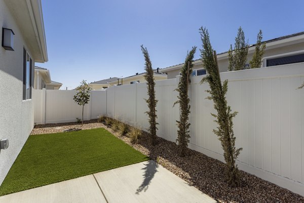 Backyard patio with modern furnishings at Vello Valley BTR Single Apartment Townhomes, perfect for outdoor relaxation and entertainment