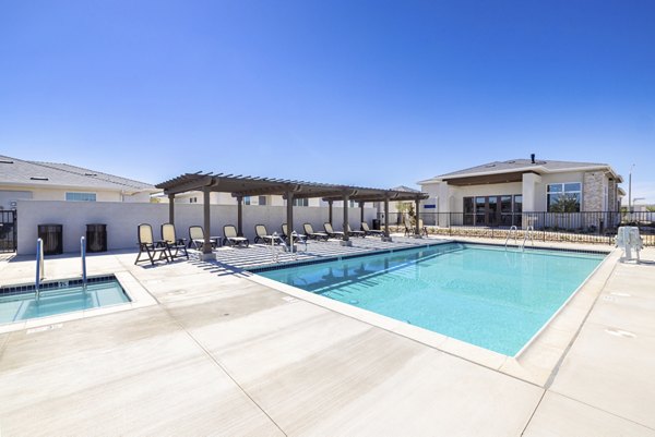 Resort-style pool with sun loungers at Vello Valley BTR Single Apartment Townhomes