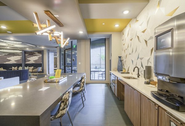 Clubhouse featuring modern lounge areas at Cadence at Frisco Station Apartments